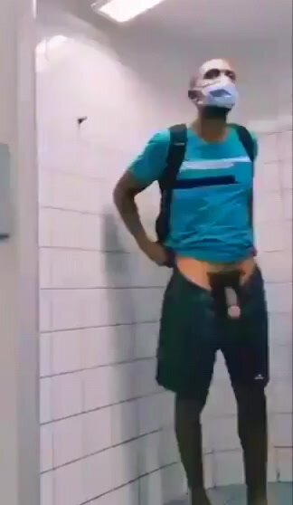 Dude showing off in public restroom