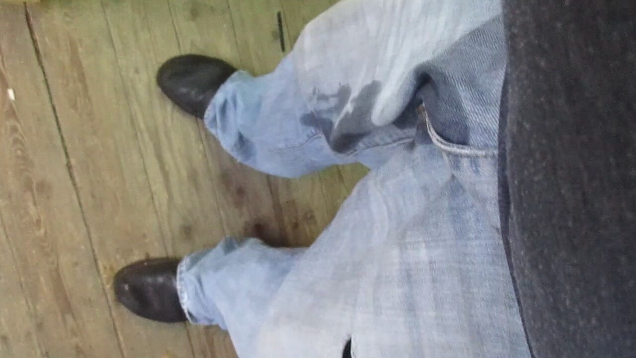 Pissing in worn out jeans