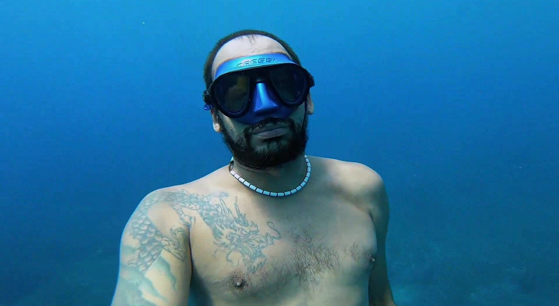 Breatholding masked underwater in sea