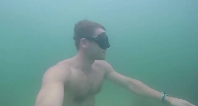 Hot freediver breatholding underwater in sea