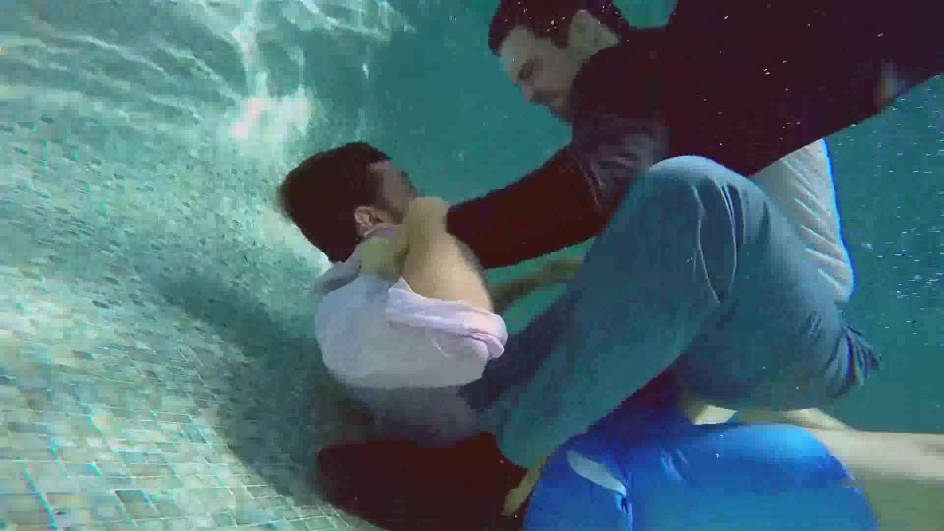 Underwater barefaced clothed fight