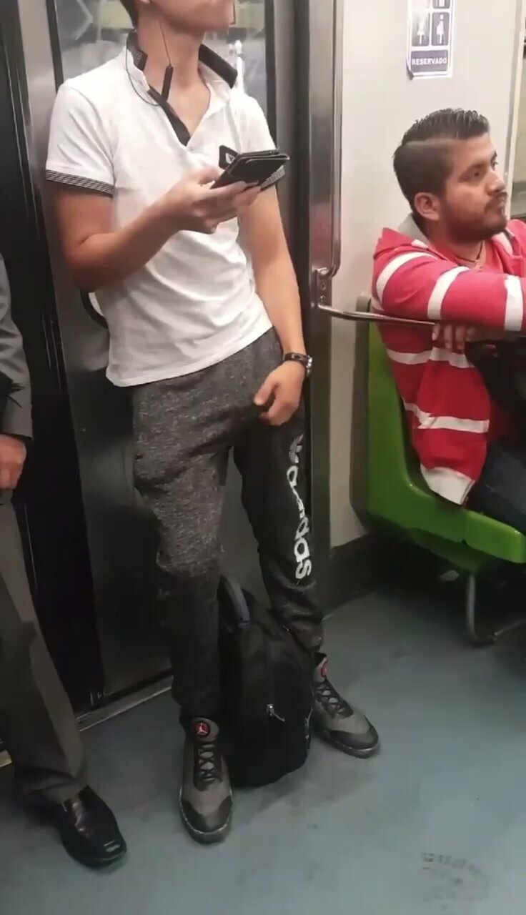 Guy grabbing his bulge