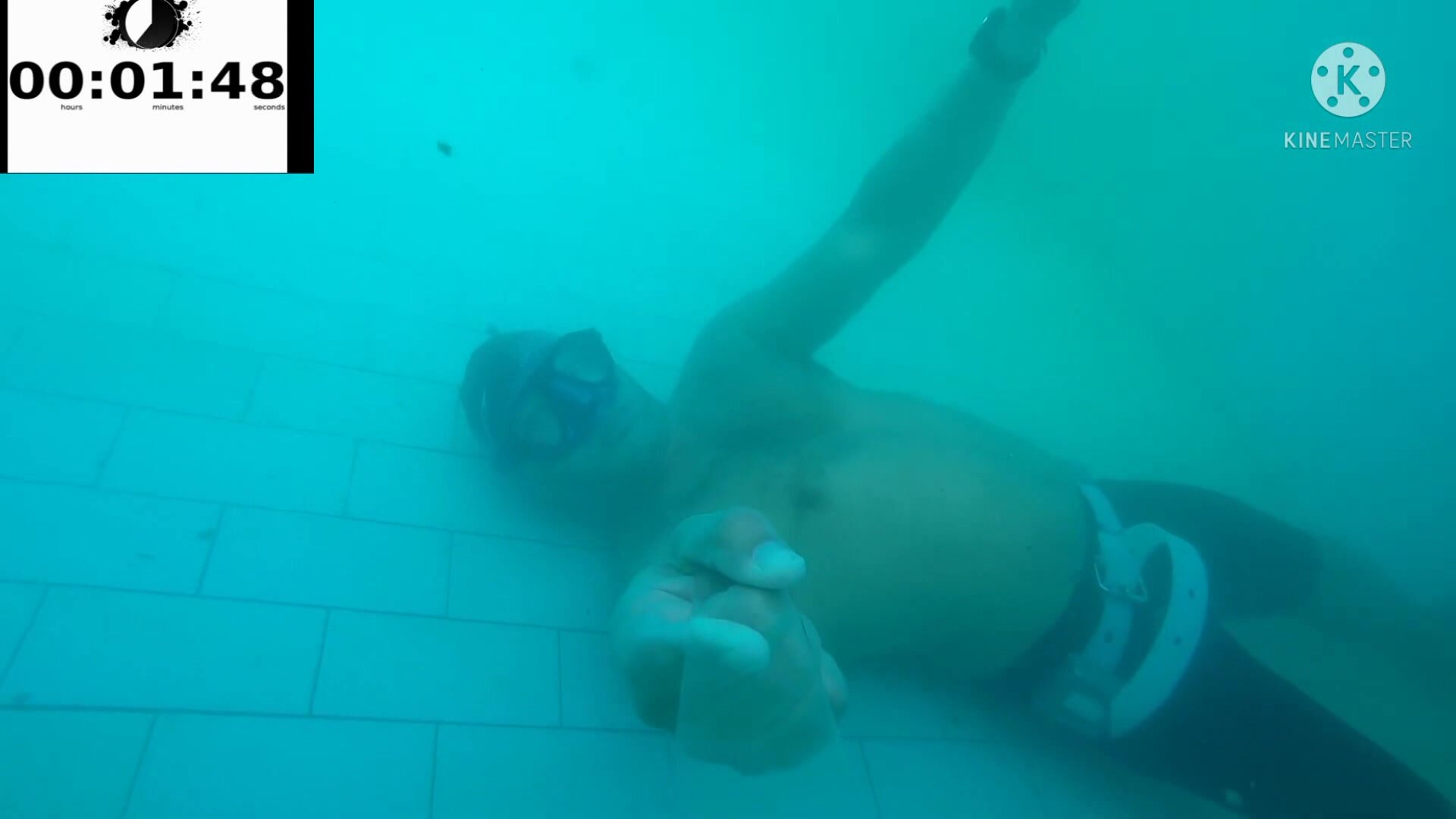 Kareem and friend breatholding underwater in pool