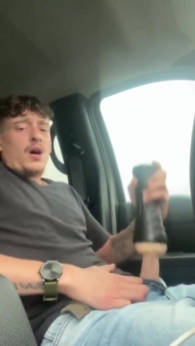 Guy useing fleshlight to cum in car