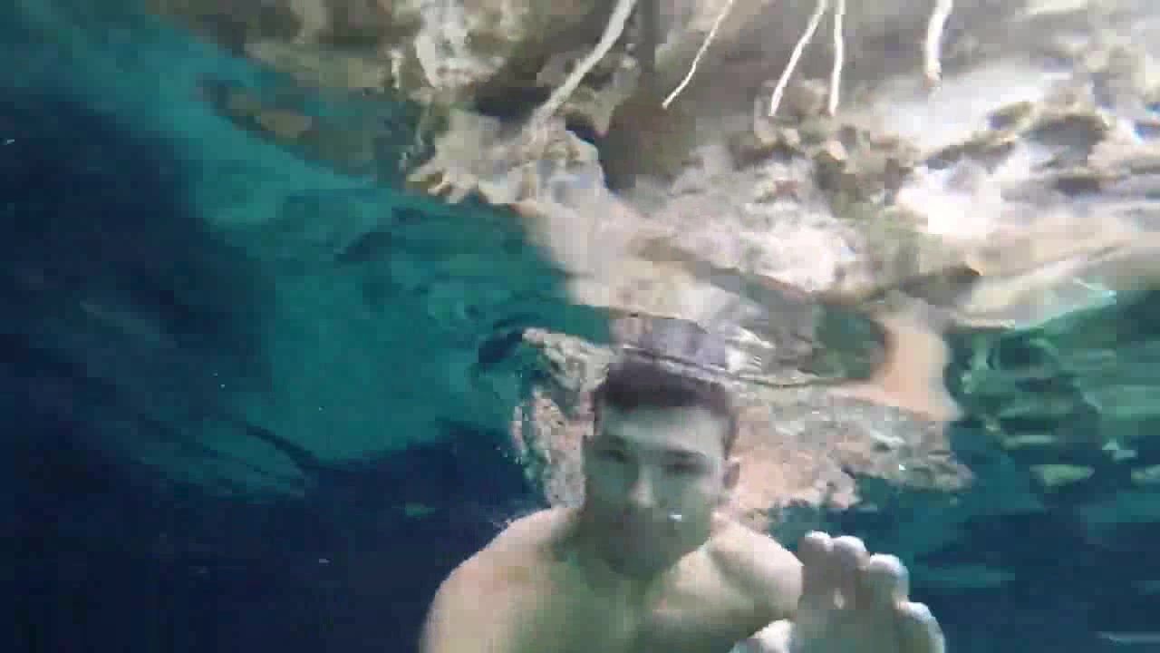 Brazilian guy swimming barefaced underwater