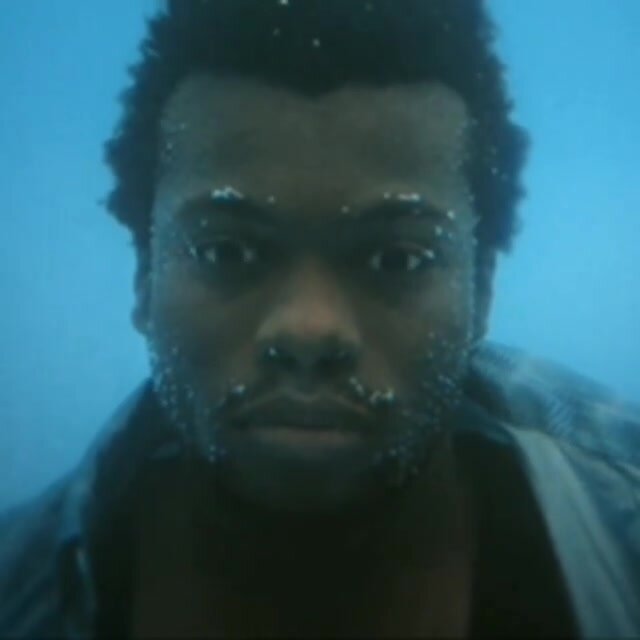 Black guy barefaced underwater