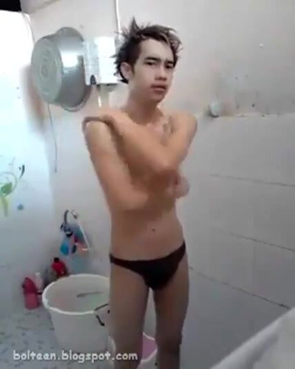 Naked Thai teenage guy showering