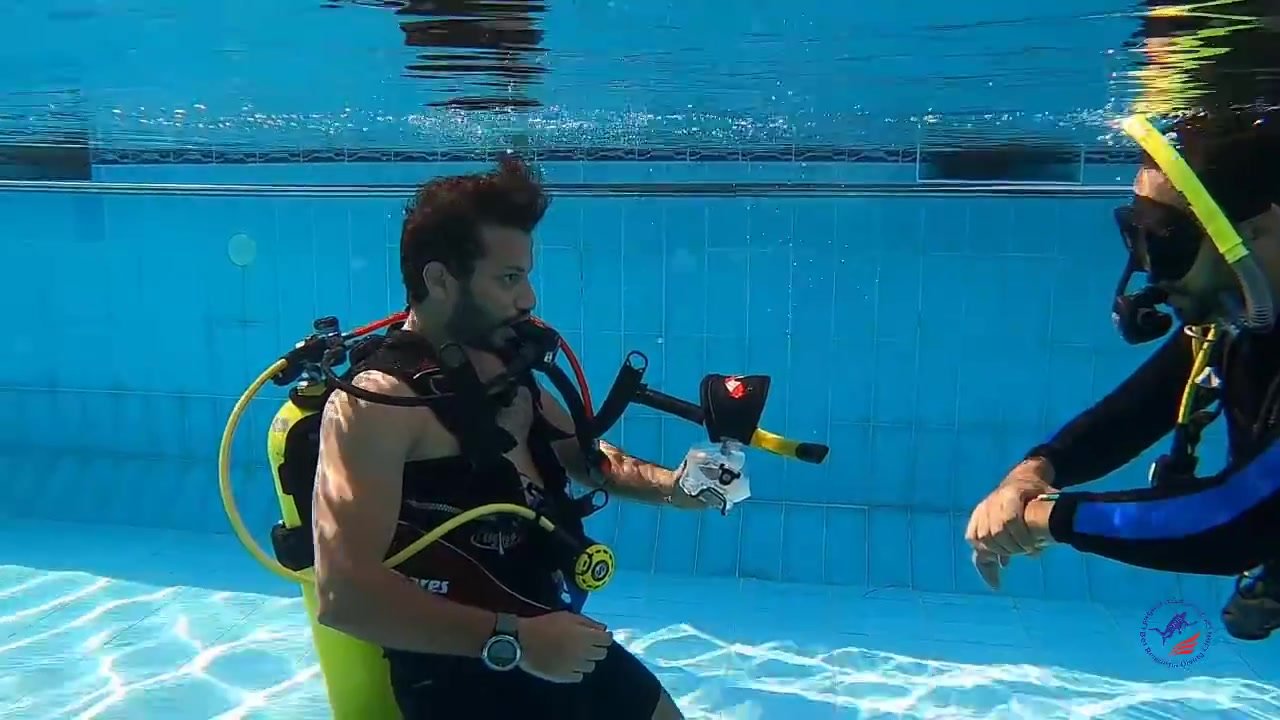 Cute scubadivers removing mask underwater