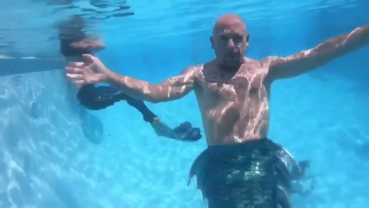 Mature merman barefaced underwater