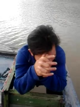 Online find of asian shitting on boat