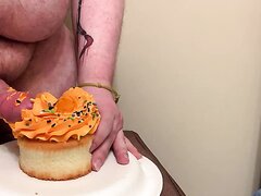 Cock destroys Halloween cupcake