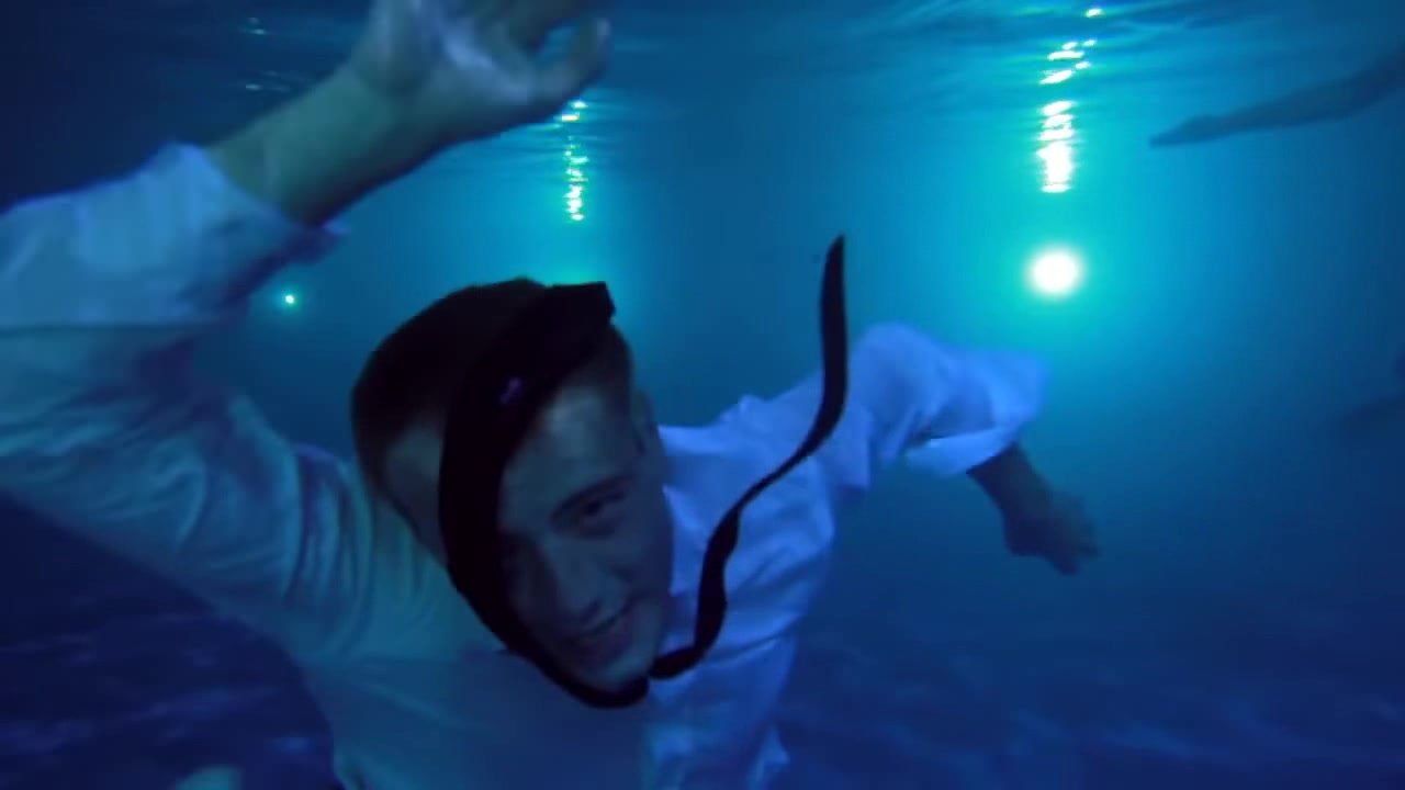 Russian singer clothed and barefaced underwater