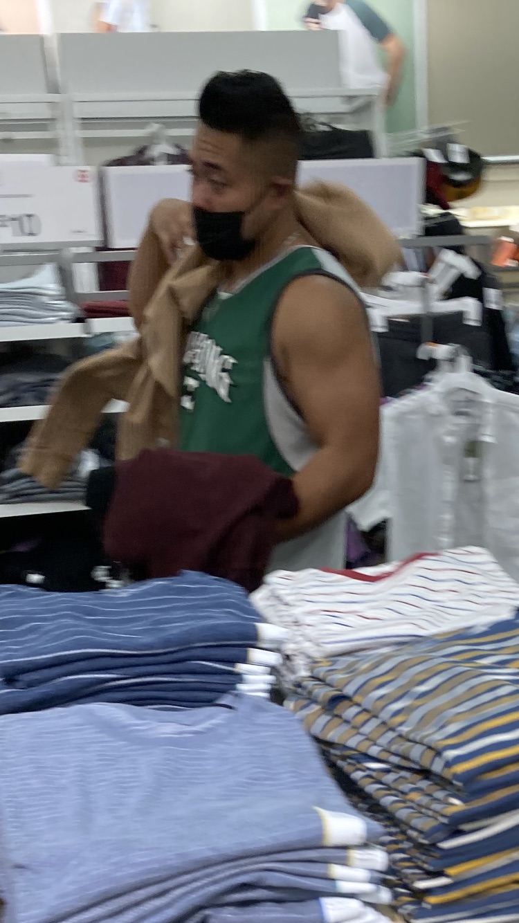 Young Asian man shits at the store