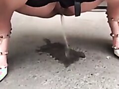 Girl pee in a parking lot - video 2