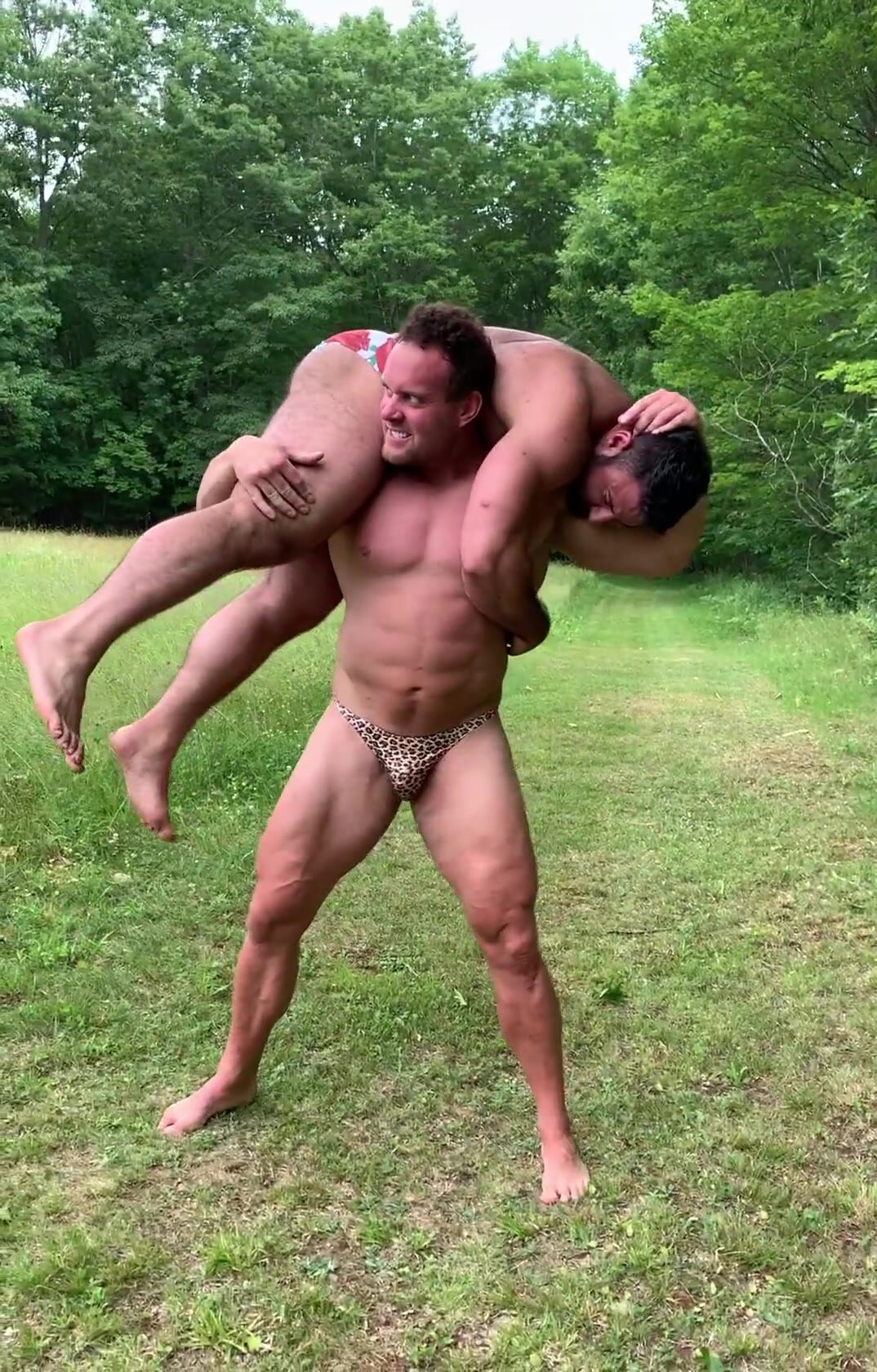 big man carries a beefy guy