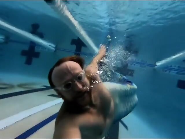 Merman Tristan underwater in pool