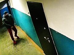 guy pissing on the wall