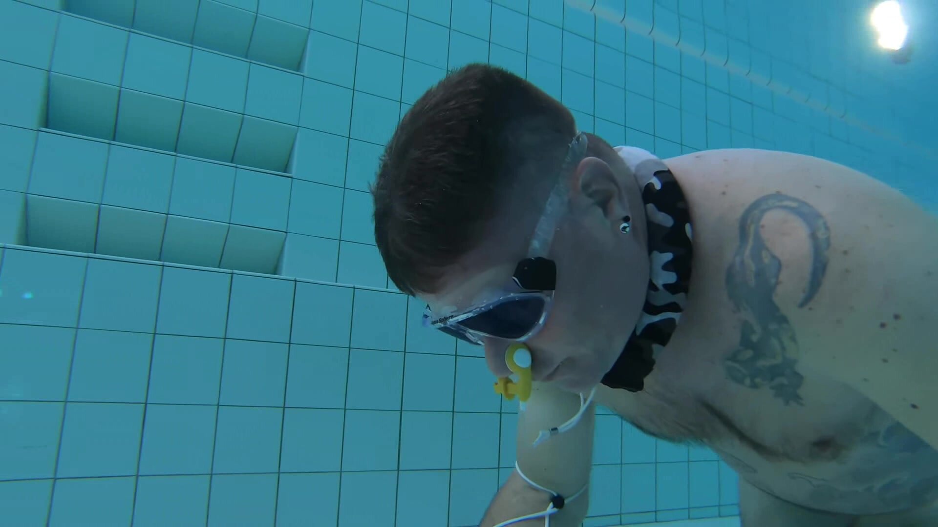 German freedivers training underwater in pool