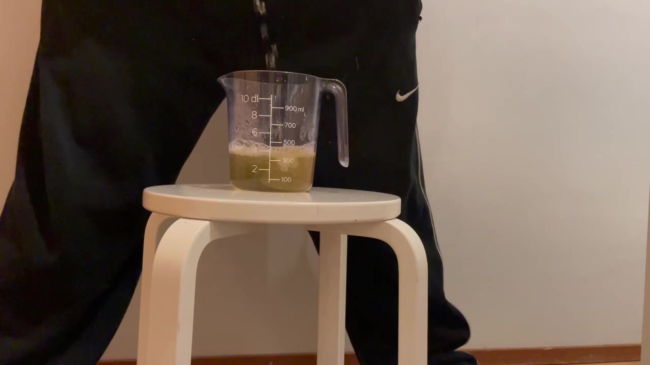 Pissing in Measuring Cup