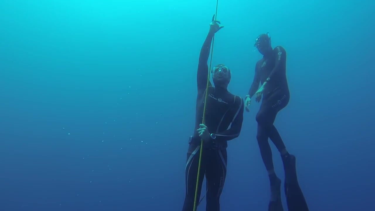 Two spanish freedivers underwater in sea