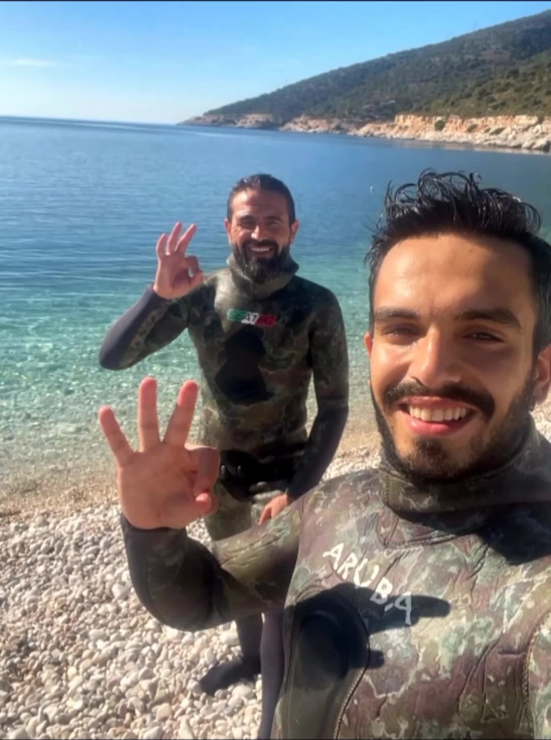Turkish freedivers underwater in wetsuits
