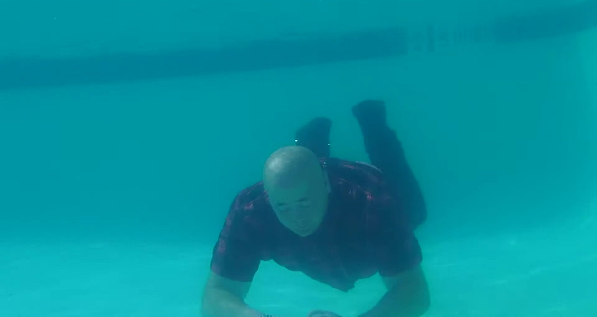 Swimming barefaced underwater fully clothed
