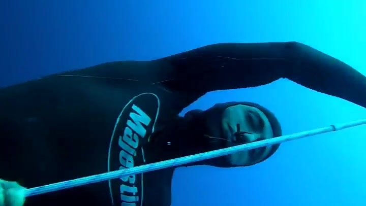 Underwater barefaced freediver in tight wetsuit - video 4