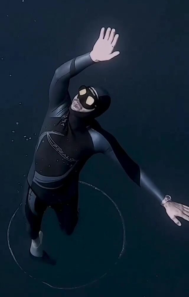 Arthur underwater in tight wetsuit