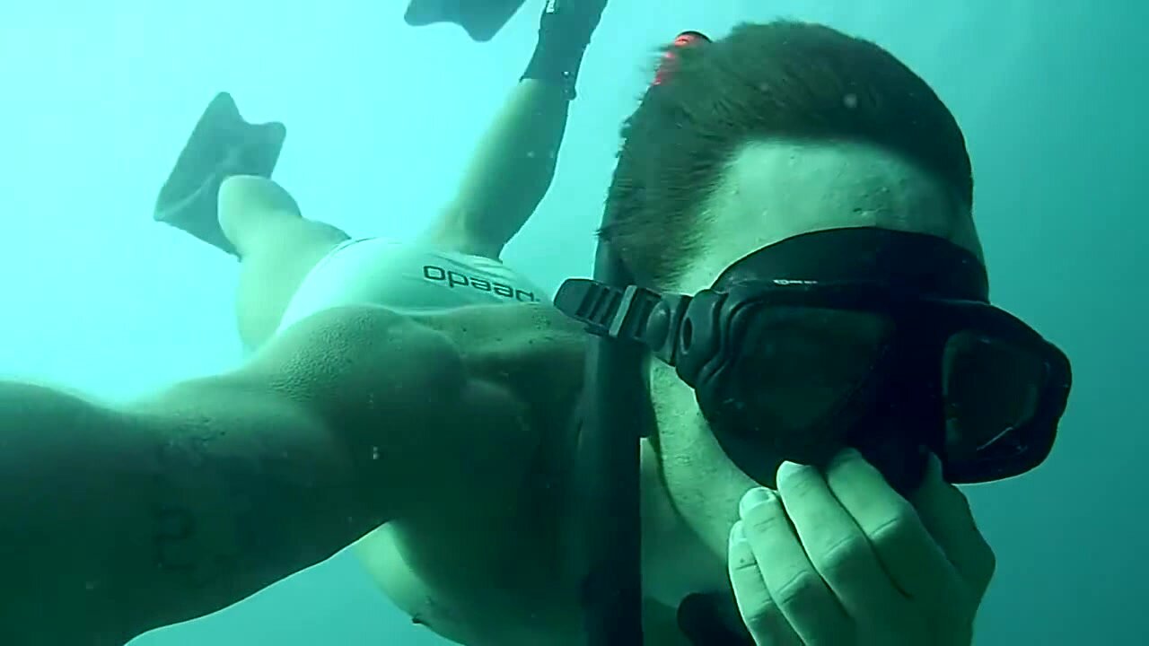 Speedo cutie freediving underwater in sea