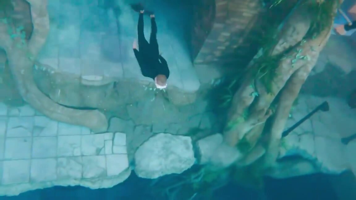 Arab freedivers having fun underwater in tank