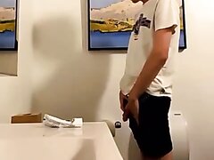 cute boy pissing in the toilet