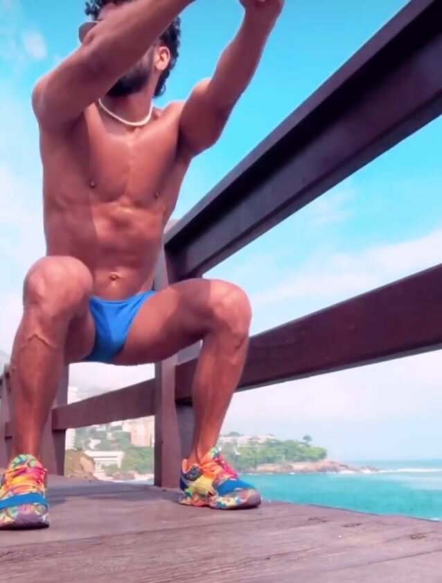 Hot guy working out on bridge
