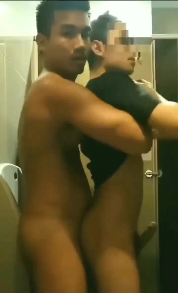Asian couple in public toilet photo