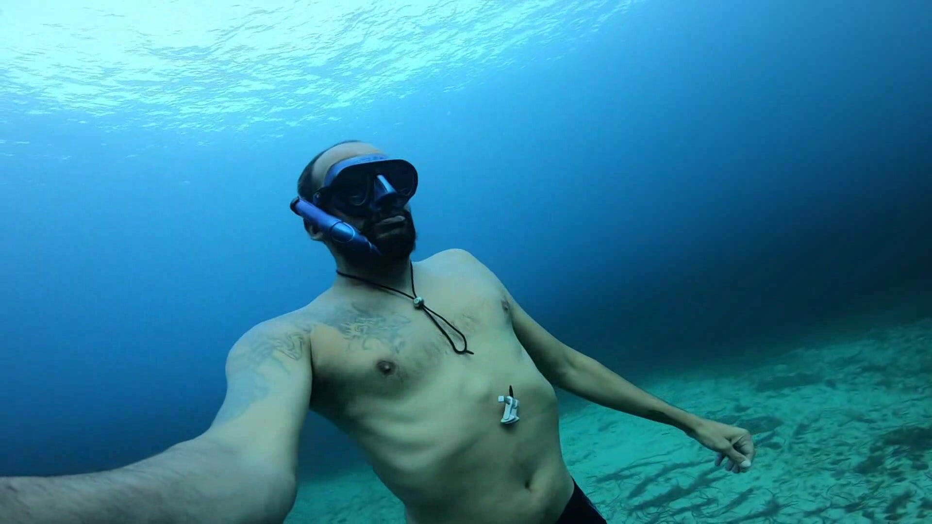 Fit freediver breatholding underwater
