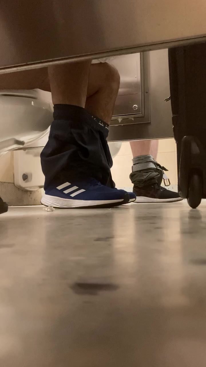 Two airport shitters listen to my farts.