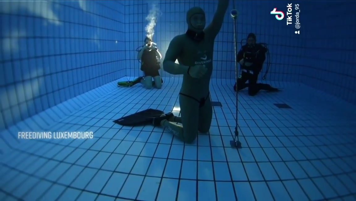 Jordan barefaced underwater in tight wetsuit