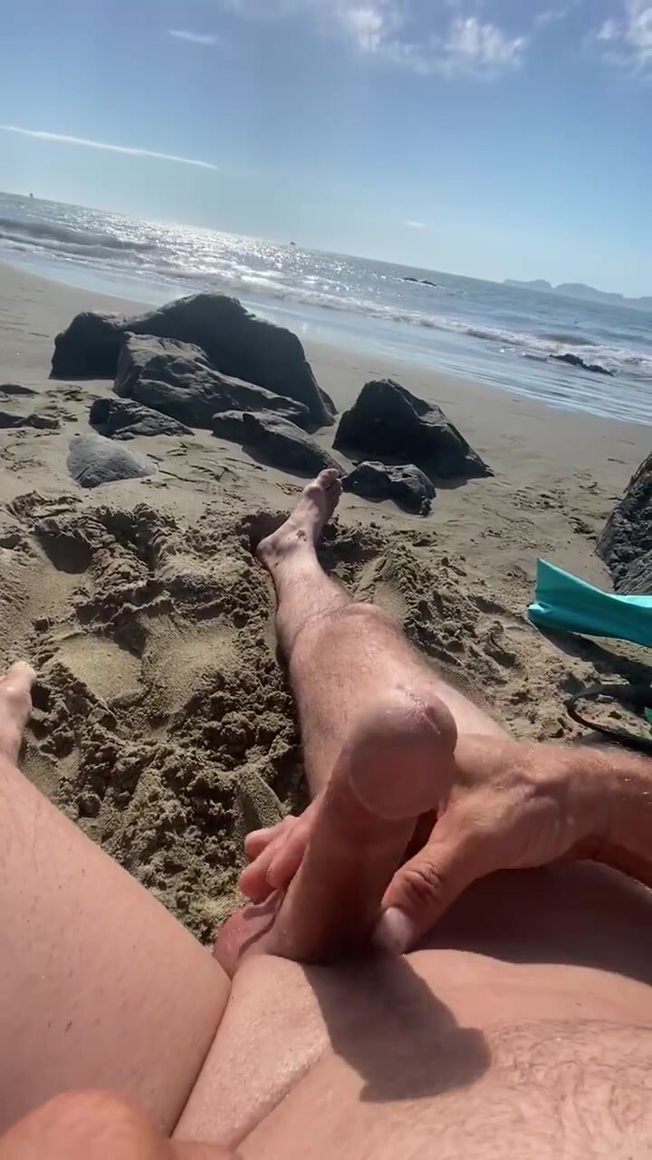 Exhibitionist having fun on the beach