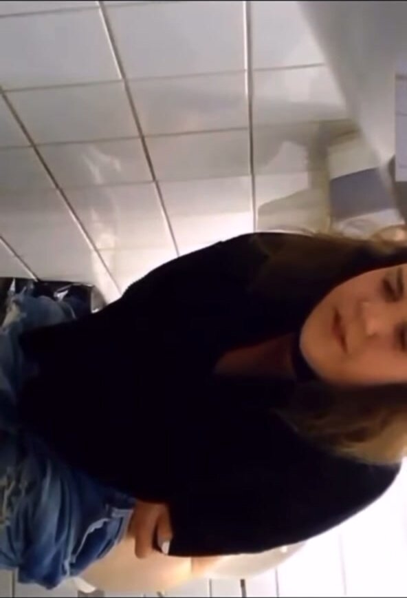 Woman pinches one off in public toilet