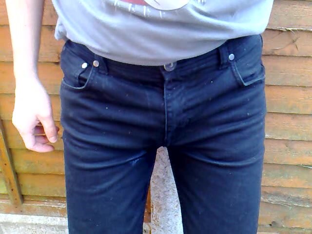 tbt rewetting black skinny jeans outside