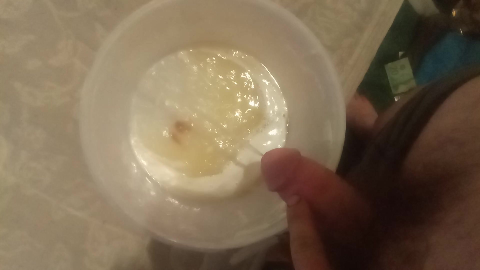 Me pissing in ice cream container.