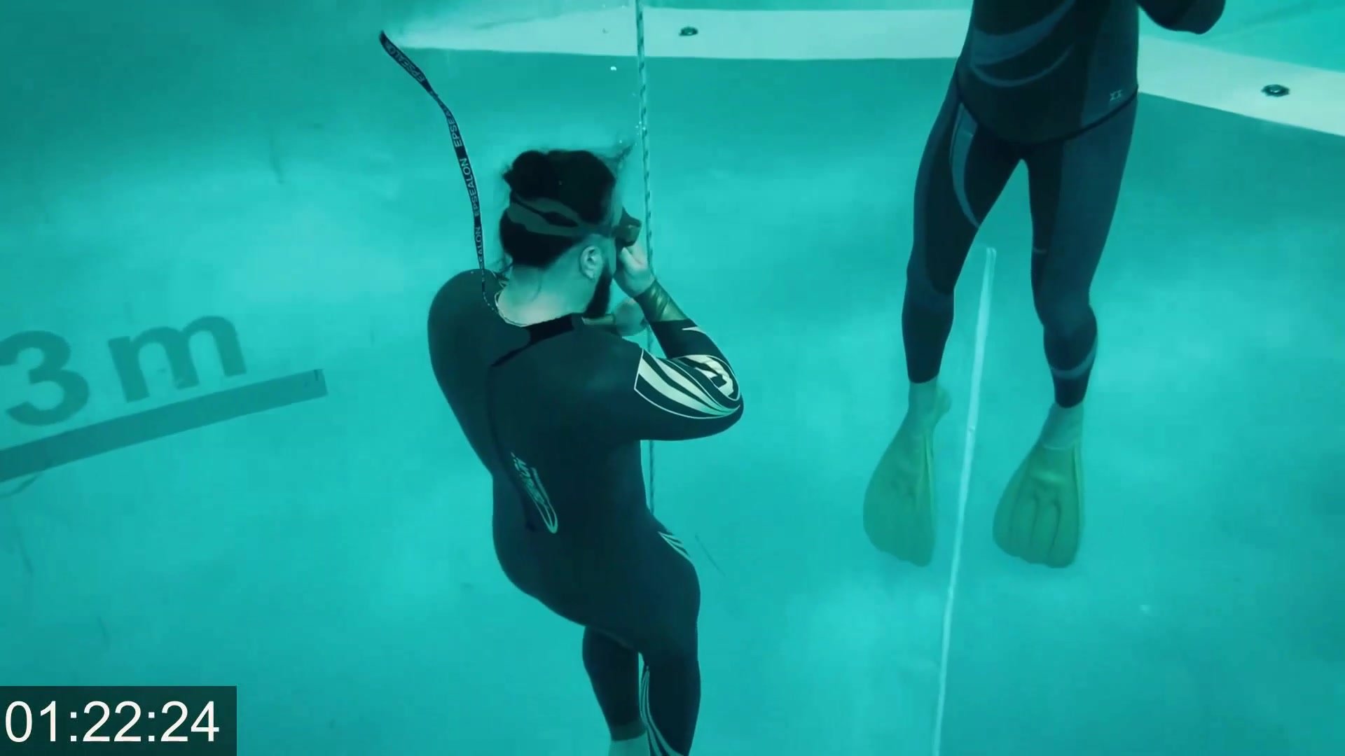 French-arab cutie trying underwater apnea in wetsuit