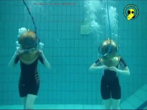 Dutch helmet divers underwater in wetsuits