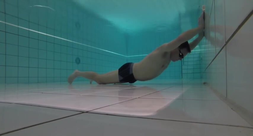 German cutie static breathold underwater in pool