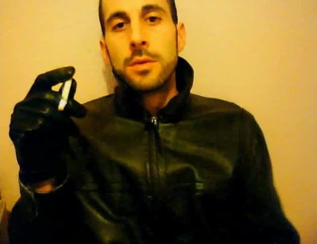 Guy in leather smokes and wanks until he cums