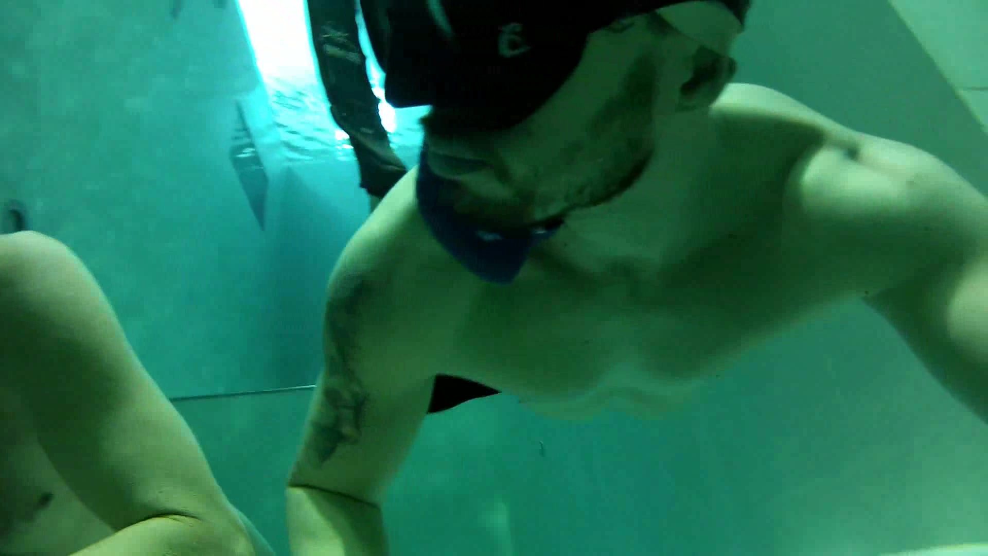 Hot speedo freedivers diving deep underwater