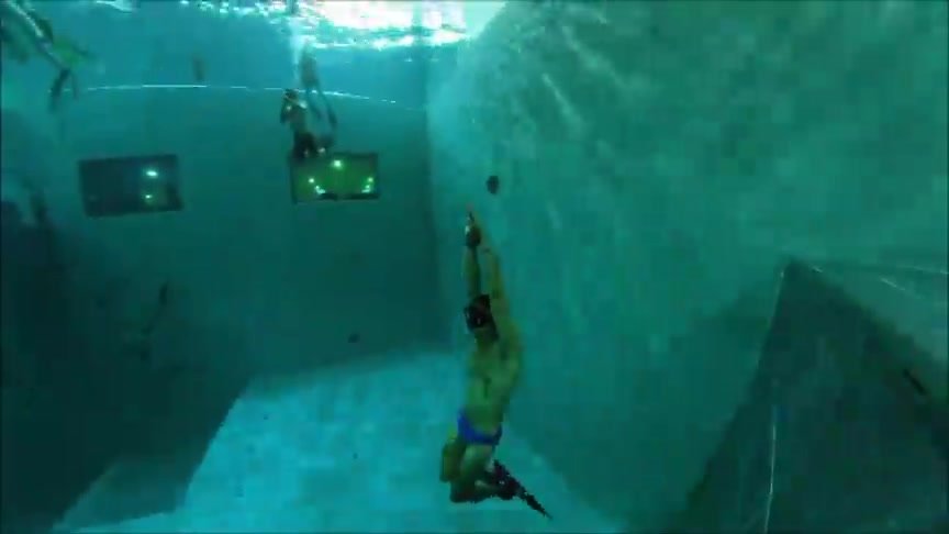 Underwater italian freedivers in speedos