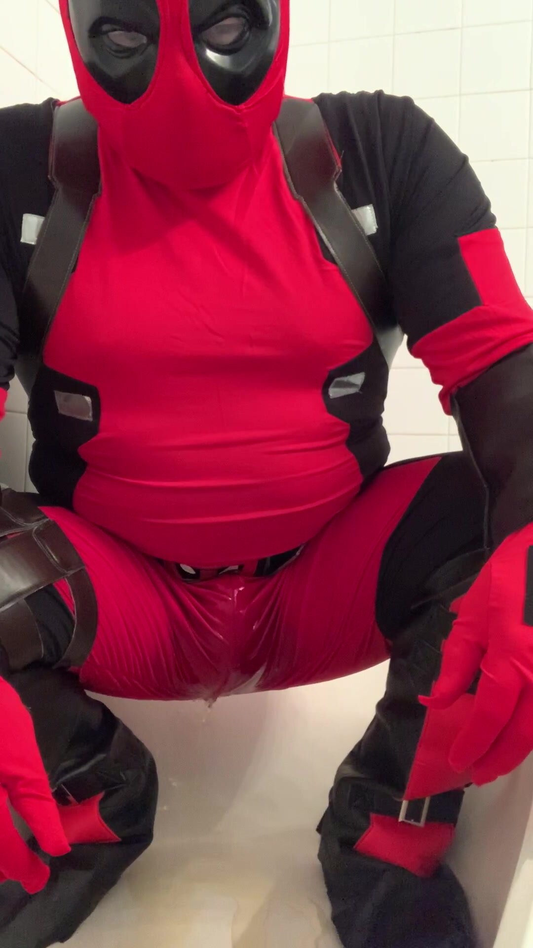 squat piss in deadpool costume
