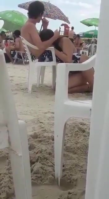 Guy gets his dick sucked on a beach