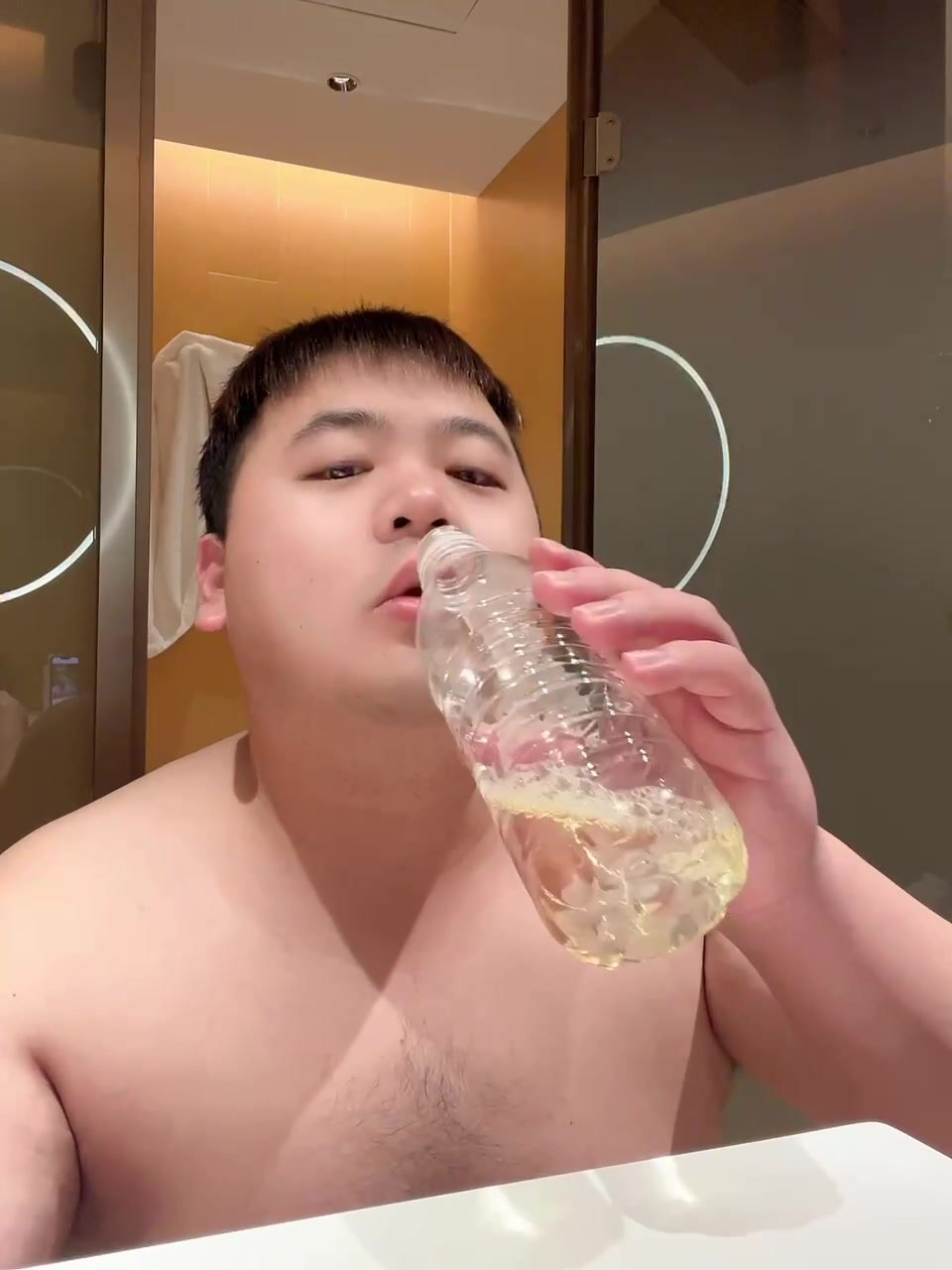 Pig Boy Kam pisses in a bottle a drinks it up!