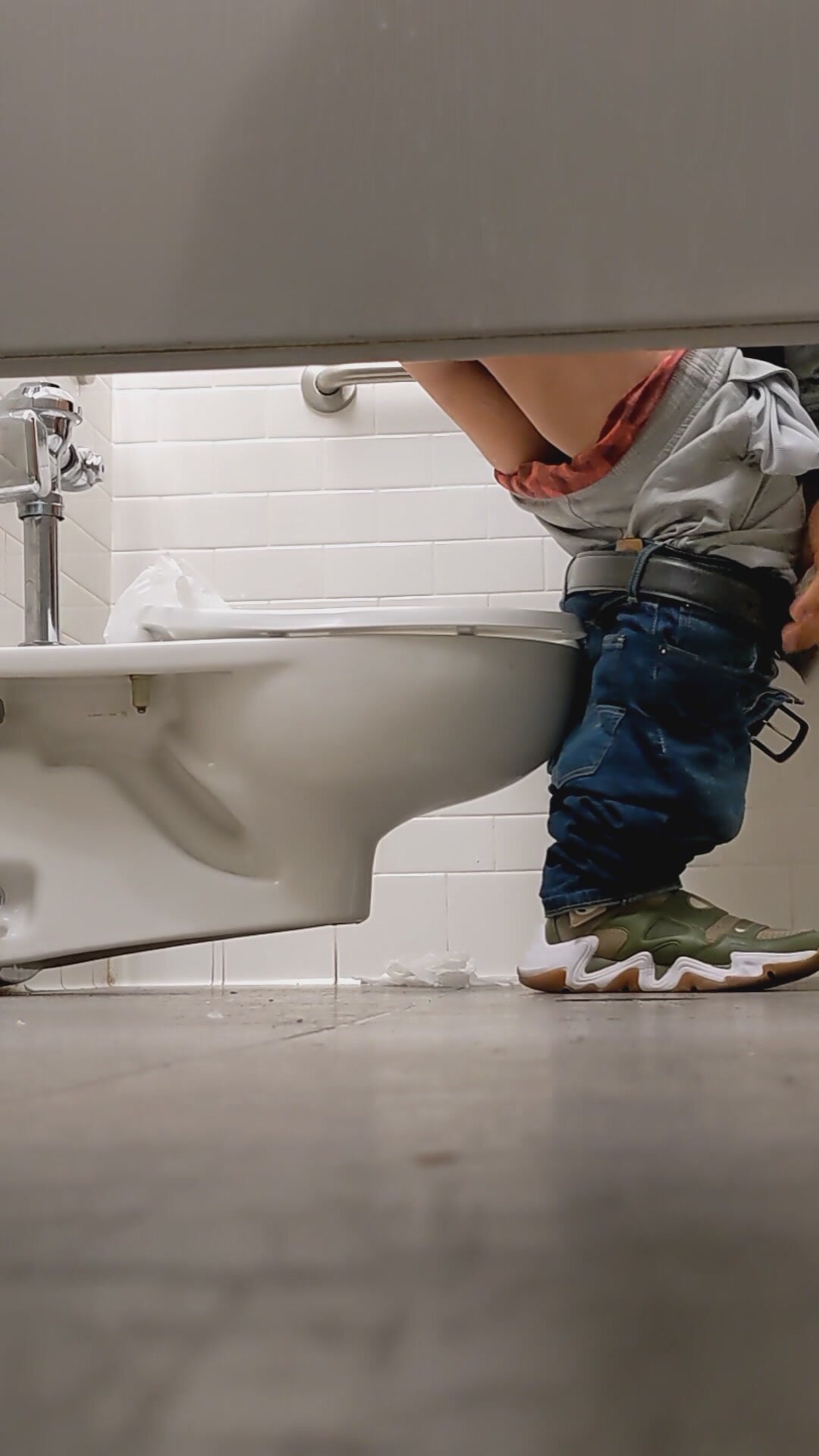 Man Wiping Ass in Toilet